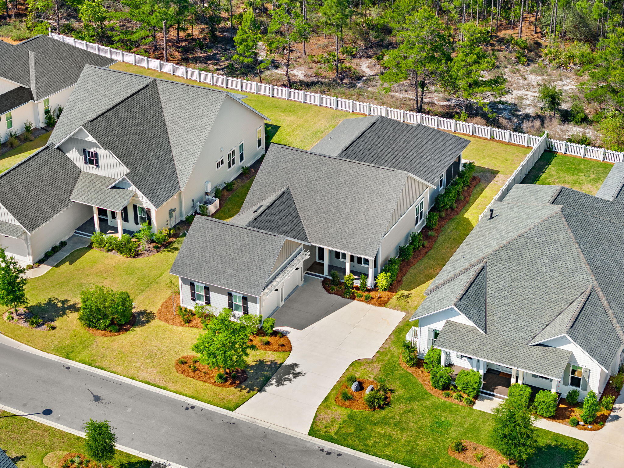 64 West Firethorn Circle Watersound, FL 32461 - Photo 41 of 63 an aerial view of a house with swimming pool and outdoor seating