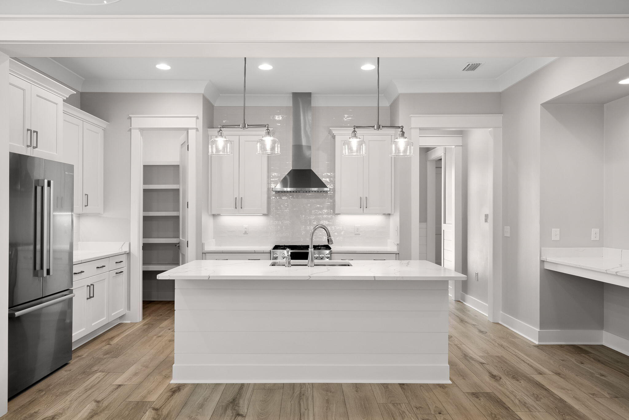 64 West Firethorn Circle Watersound, FL 32461 - Photo 10 of 63 a large kitchen with stainless steel appliances granite countertop a sink a refrigerator and a stove