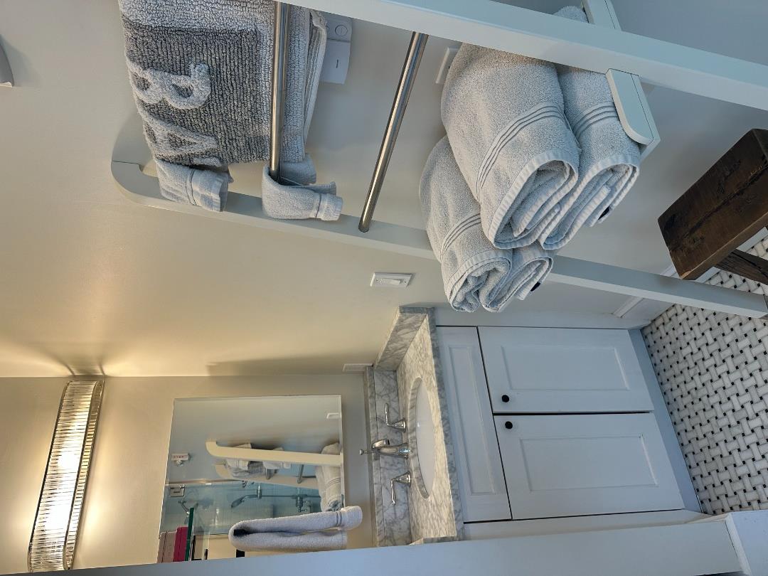68 Winter Street, Unit 2 Edgartown, MA 02539 - Photo 13 of 19 a bathroom with a sink and a mirror