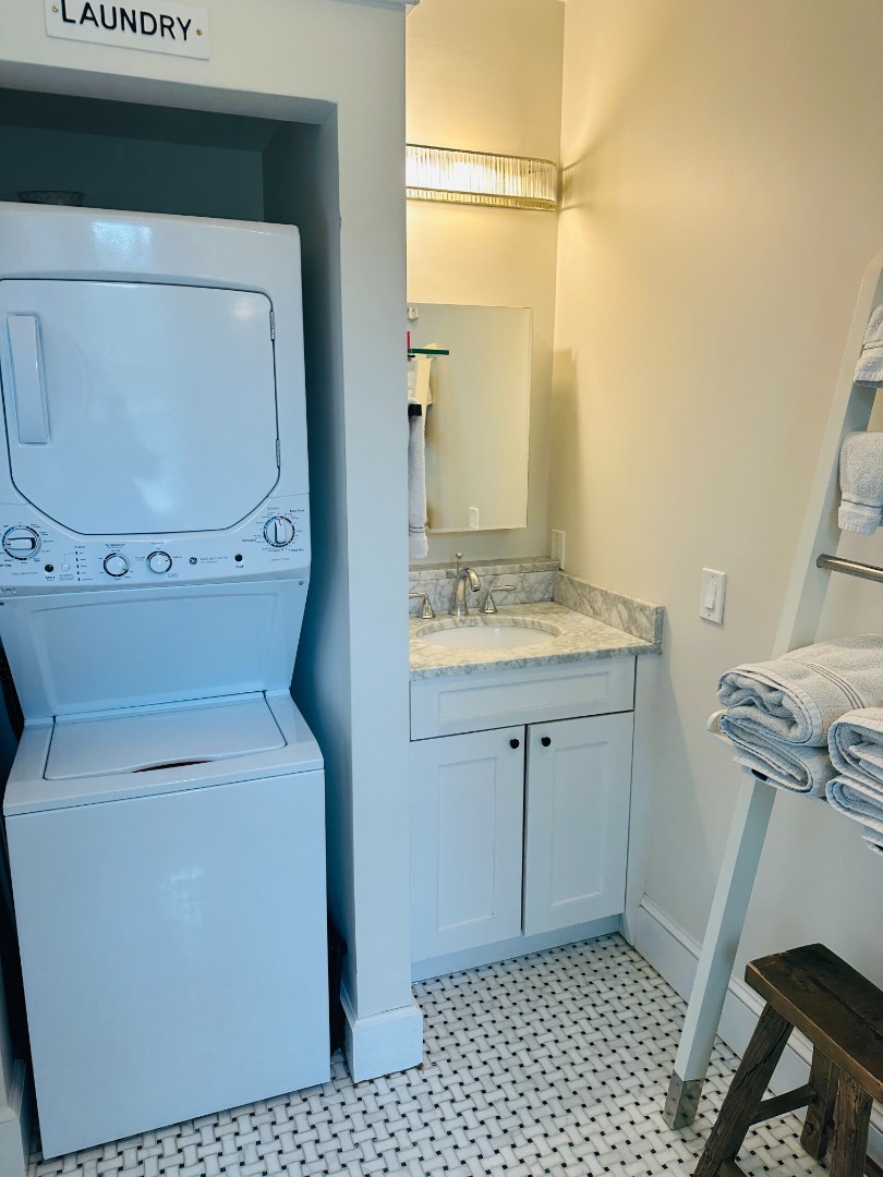 68 Winter Street, Unit 2 Edgartown, MA 02539 - Photo 14 of 19 a bathroom with a sink a toilet and a mirror