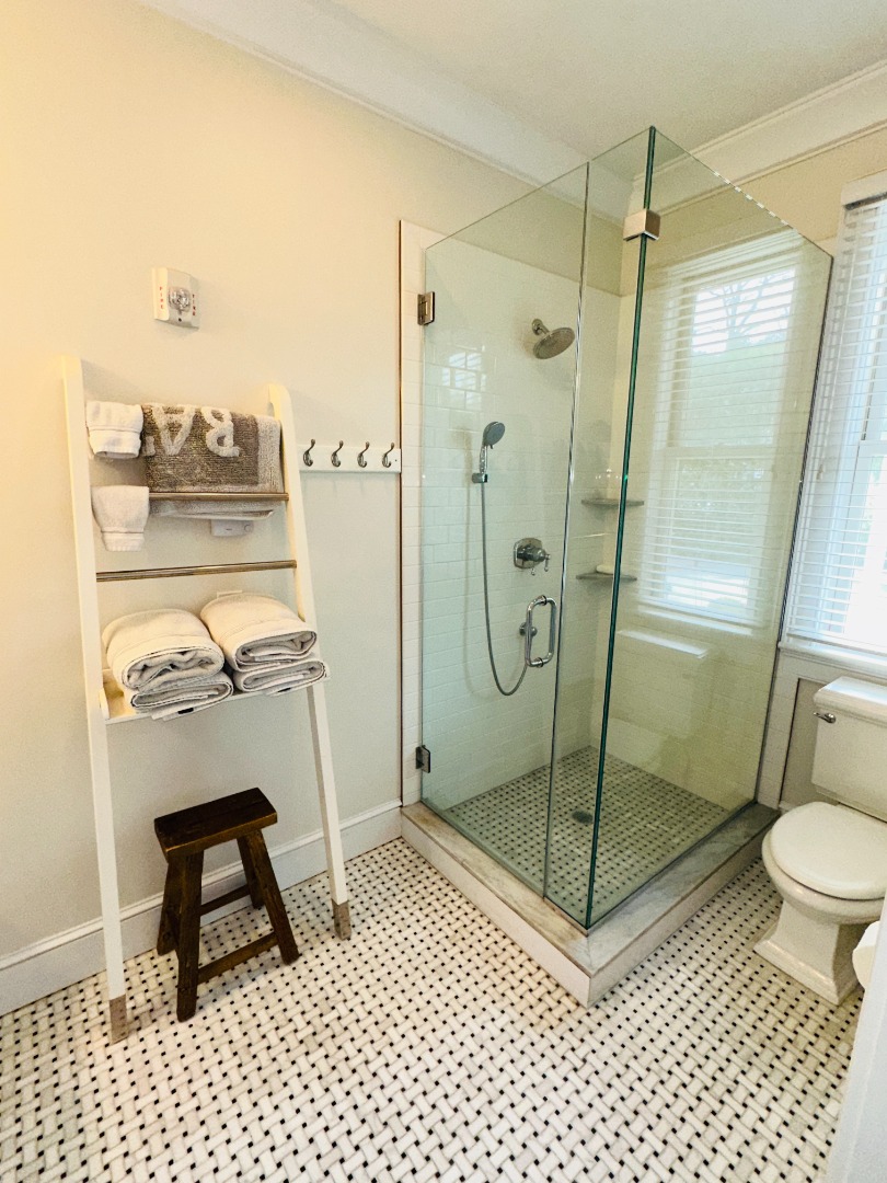 68 Winter Street, Unit 2 Edgartown, MA 02539 - Photo 16 of 19 a bathroom with a shower a toilet and sink