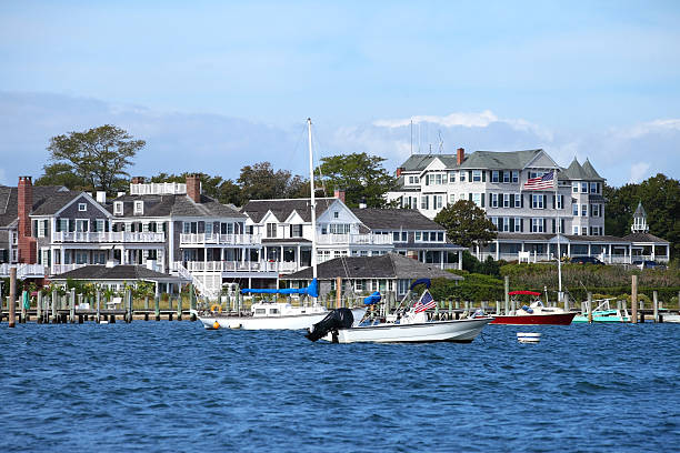 68 Winter Street, Unit 2 Edgartown, MA 02539 - Photo 19 of 19 a view of a lake with a building and large trees