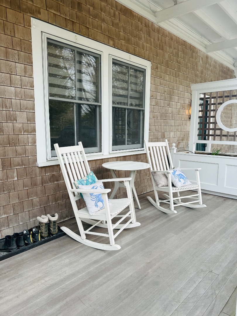 68 Winter Street, Unit 2 Edgartown, MA 02539 - Photo 3 of 19 a wooden bench sitting in front of a building