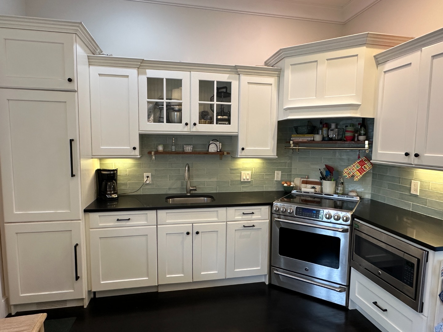 68 Winter Street, Unit 2 Edgartown, MA 02539 - Photo 8 of 19 a kitchen with granite countertop white cabinets and appliances