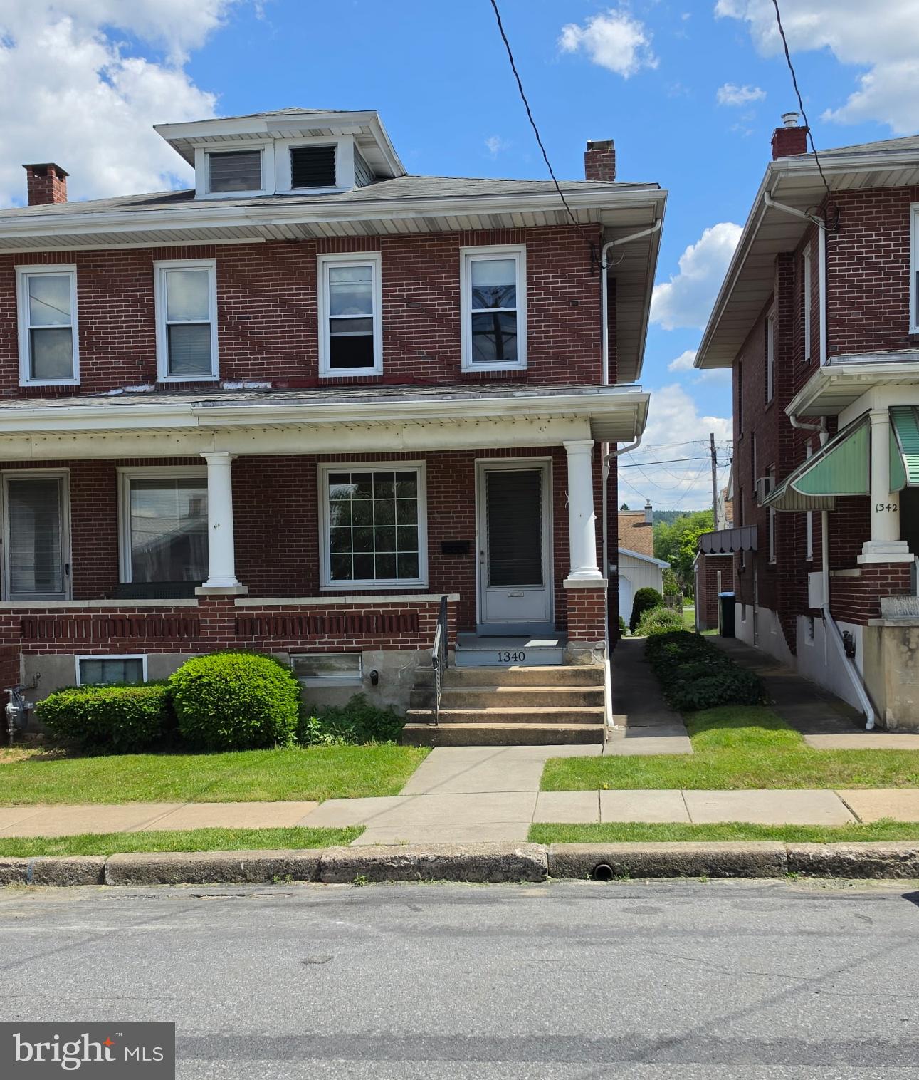 Charming brick duplex with classic appeal.