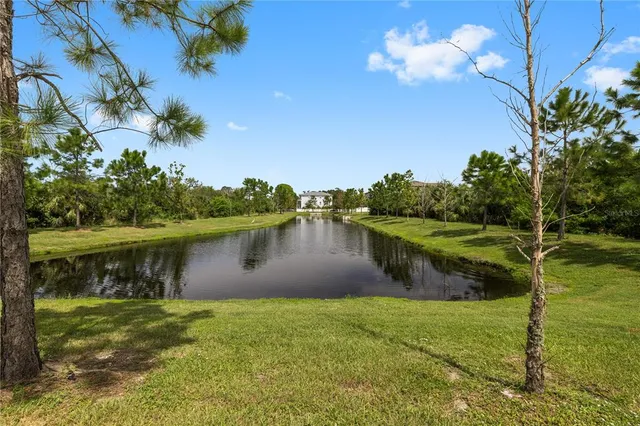 a view of a lake with a yard