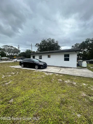 a view of a swimming pool with an outdoor seating