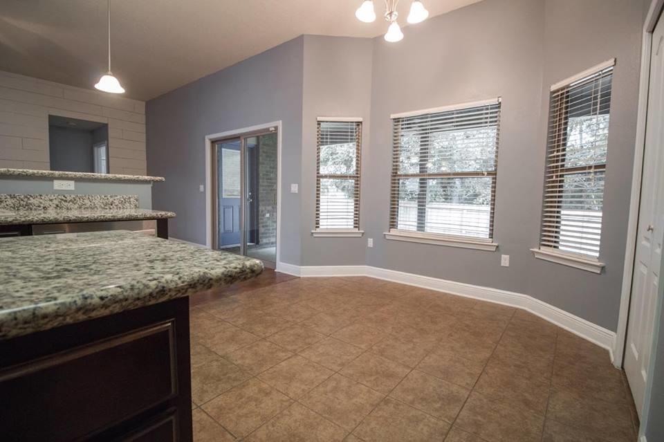 4500 Hermosa Road Crestview, FL 32539 - Photo 11 of 27 a bathroom with a granite countertop sink and window