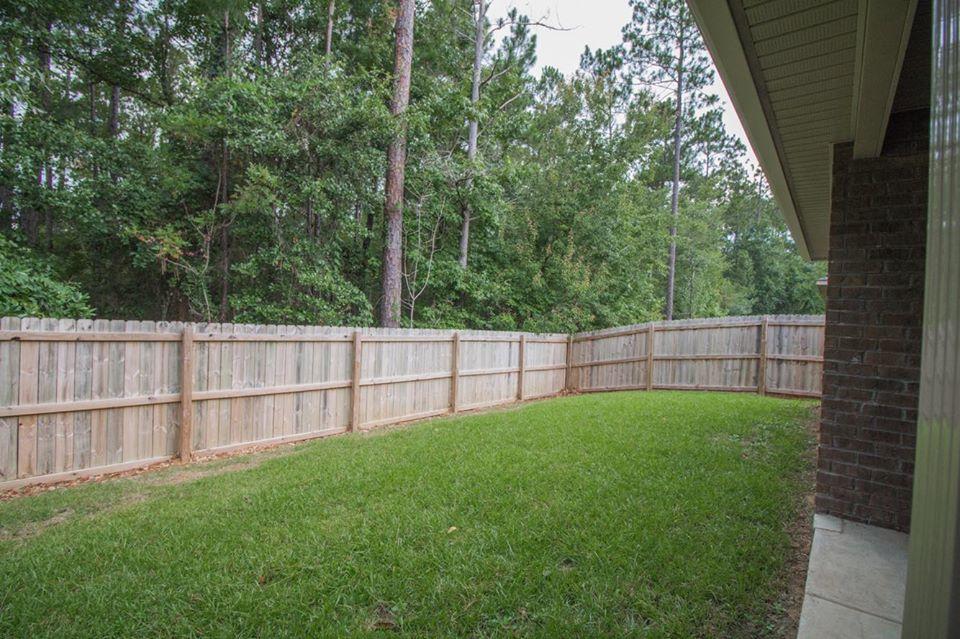 4500 Hermosa Road Crestview, FL 32539 - Photo 27 of 27 a view of backyard with green space and wooden fence