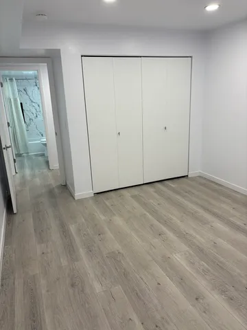 a view of a balcony with wooden floor and outdoor space