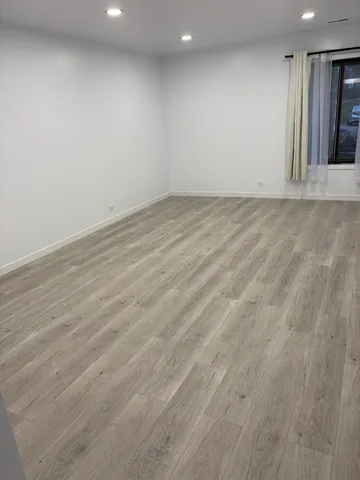 a living room with furniture a rug and a window