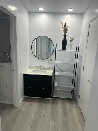 a bathroom with a sink and a mirror