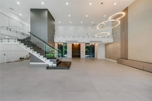 a lobby with furniture and a rug