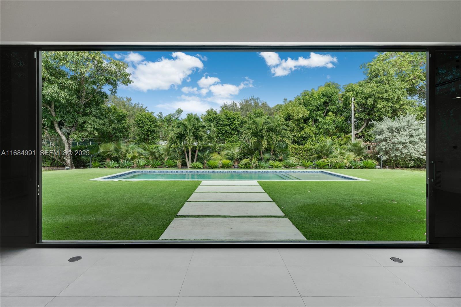 6695 Southwest 112th Street Pinecrest, FL 33156 - Photo 29 of 99 a view of a garden