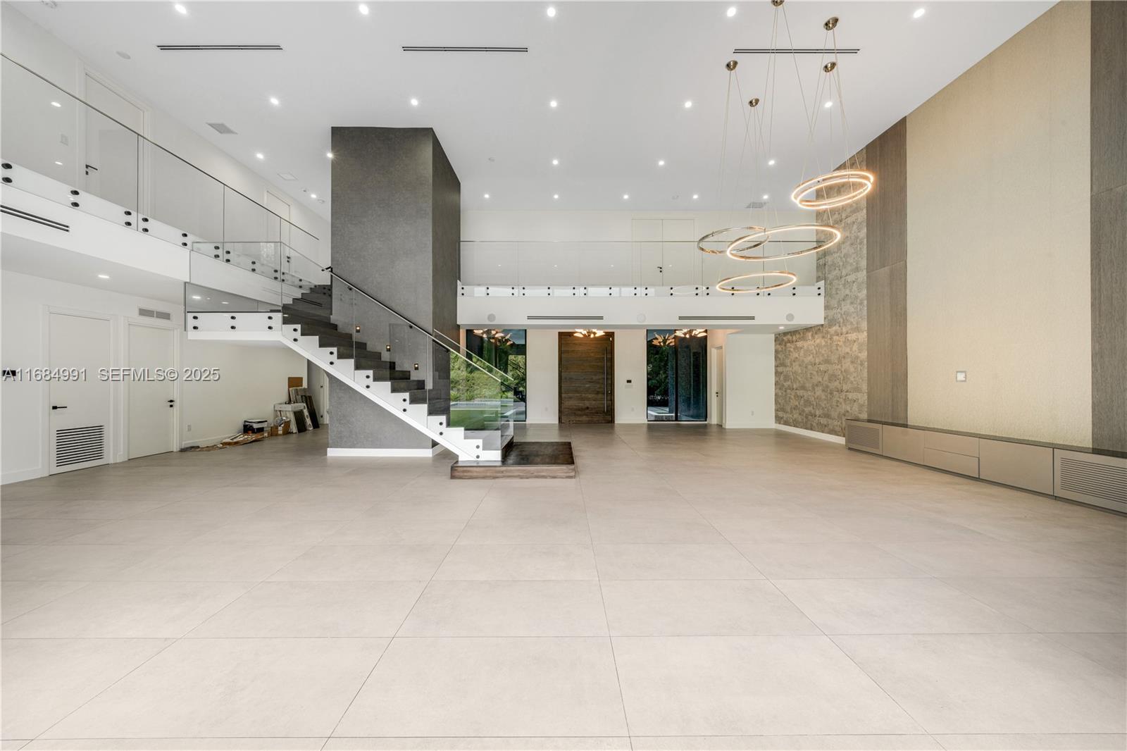6695 Southwest 112th Street Pinecrest, FL 33156 - Photo 30 of 99 a view of an empty room with gym equipment