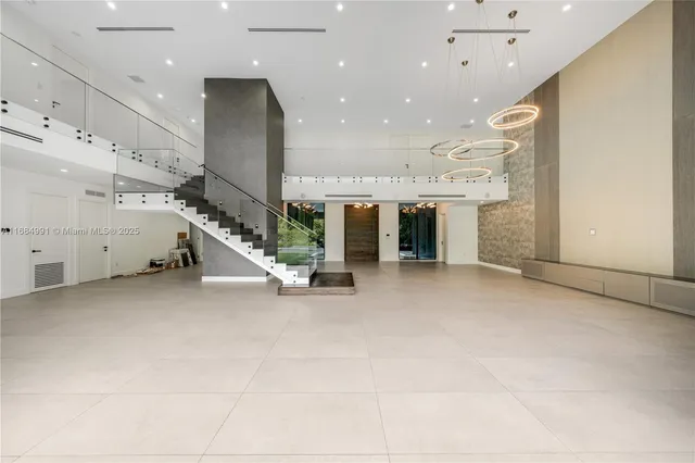 a large white bedroom with a large bed