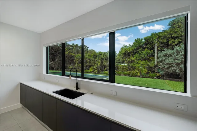 a view of a backyard with swimming pool