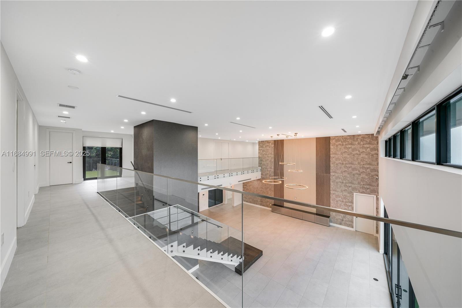 6695 Southwest 112th Street Pinecrest, FL 33156 - Photo 55 of 99 a lobby with furniture and a rug