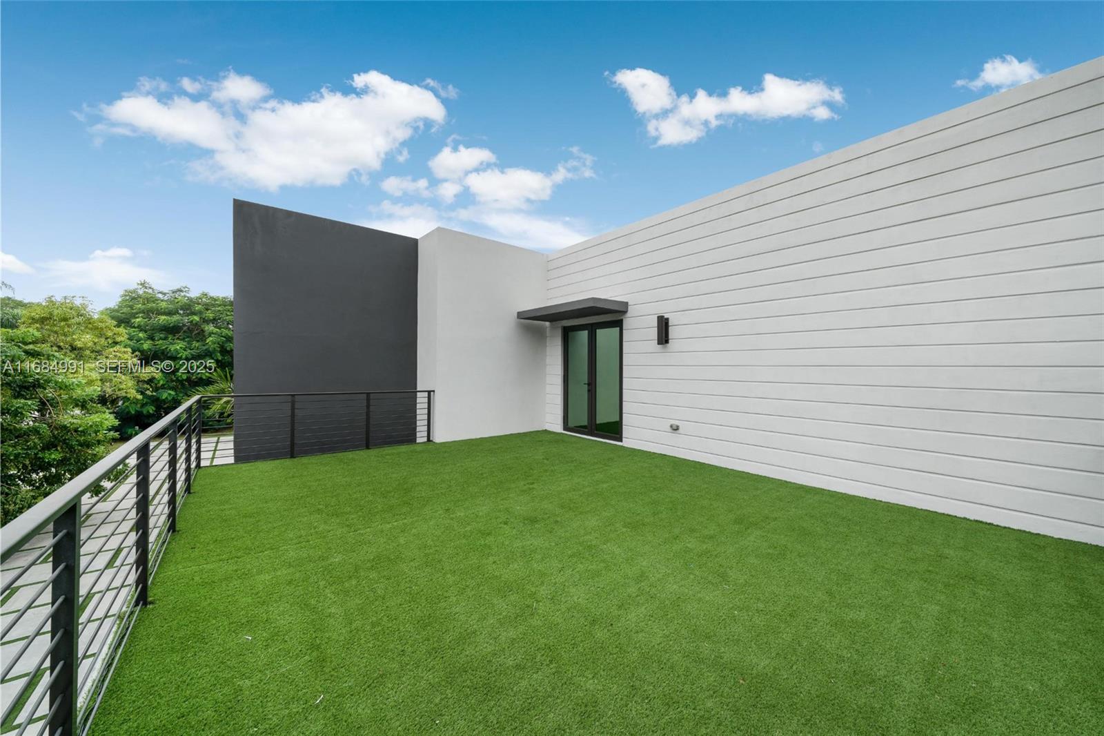 6695 Southwest 112th Street Pinecrest, FL 33156 - Photo 57 of 99 a view of a house with backyard and garden