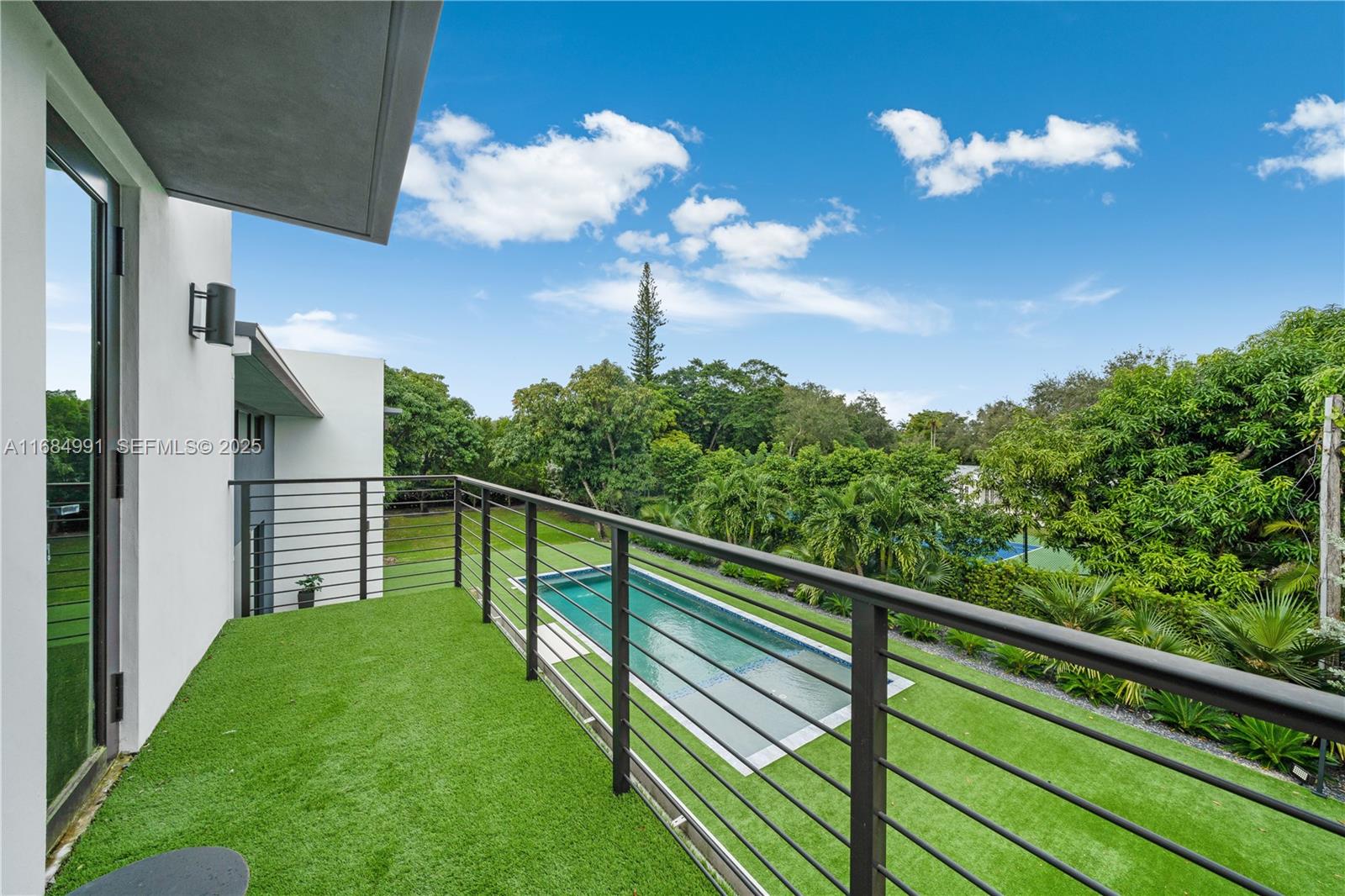 6695 Southwest 112th Street Pinecrest, FL 33156 - Photo 59 of 99 a view of a balcony with an outdoor space