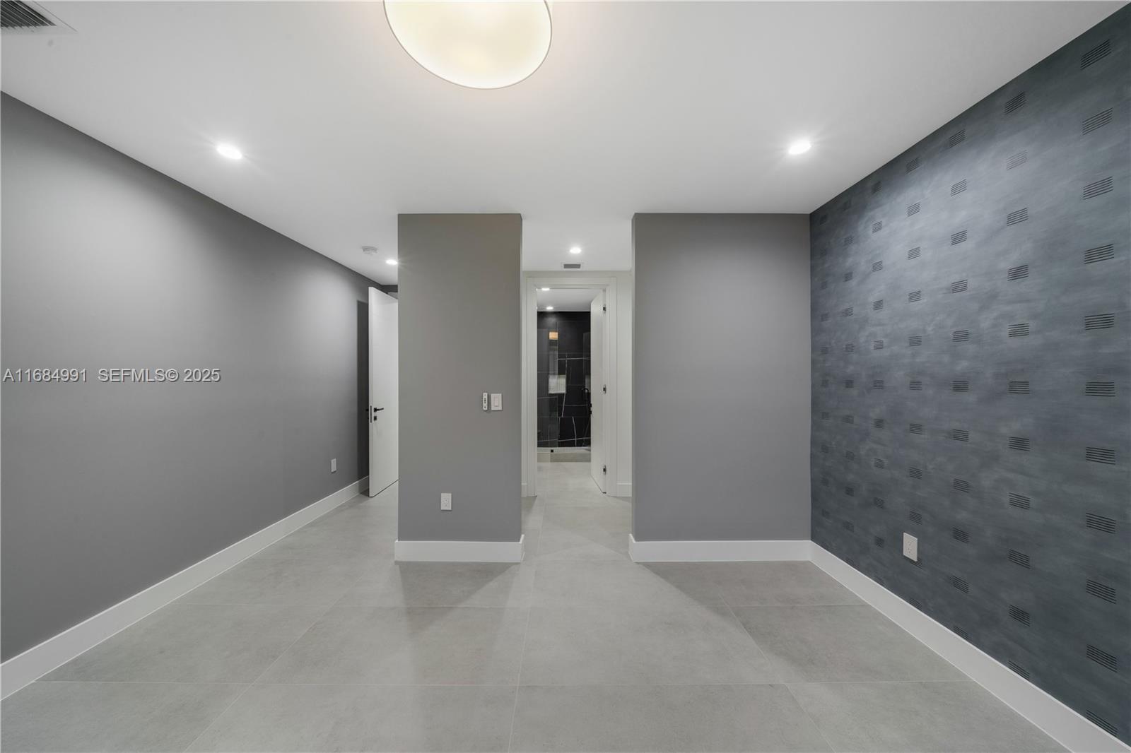 6695 Southwest 112th Street Pinecrest, FL 33156 - Photo 67 of 99 an empty room with a bathroom