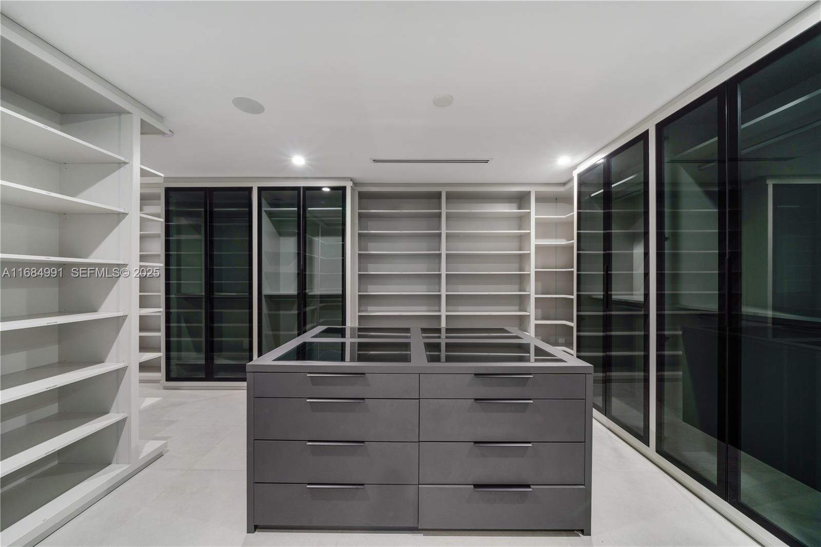 6695 Southwest 112th Street Pinecrest, FL 33156 - Photo 76 of 99 a view of walk in closet