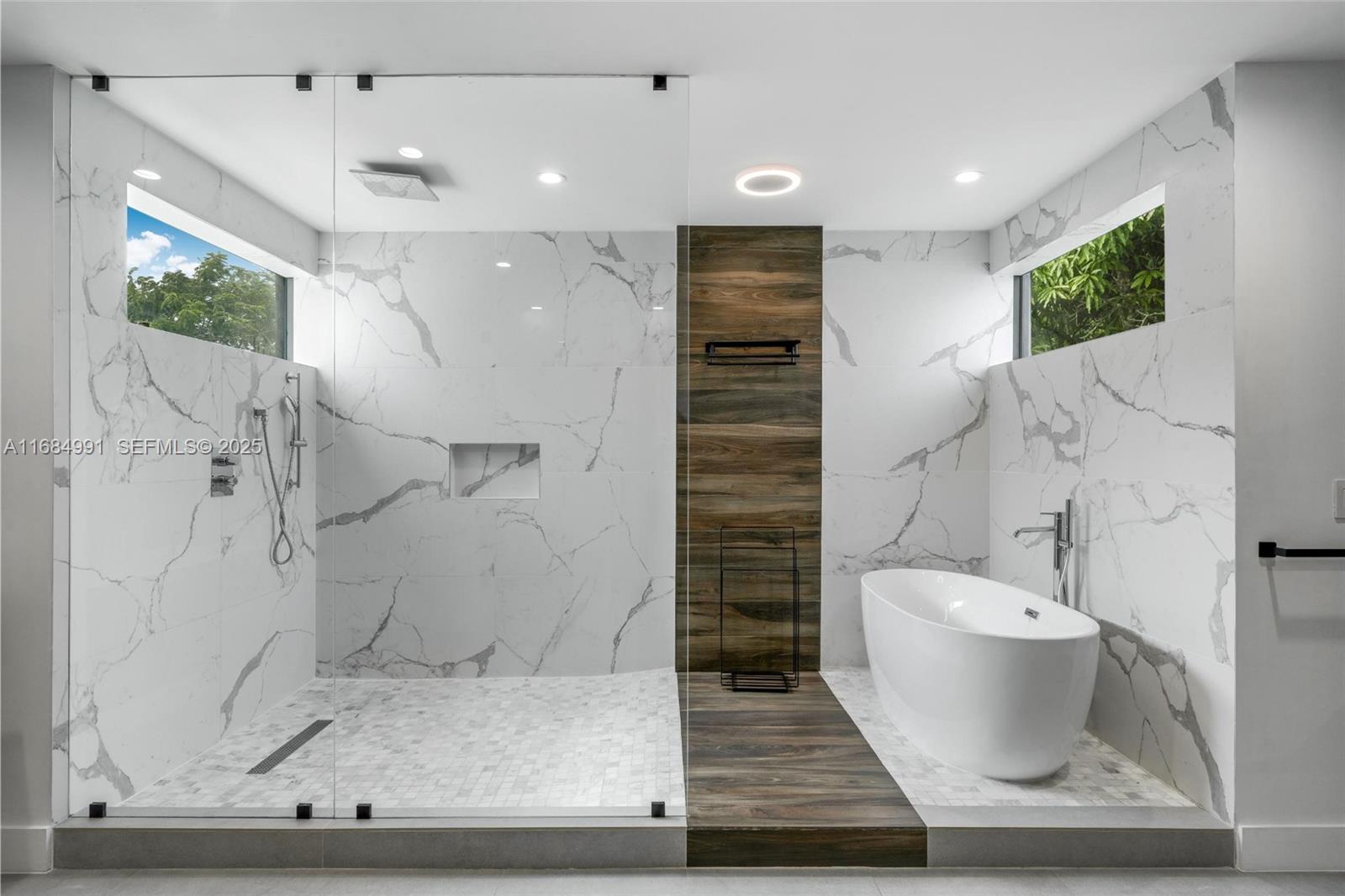 6695 Southwest 112th Street Pinecrest, FL 33156 - Photo 80 of 99 a bathroom with a sink and a mirror