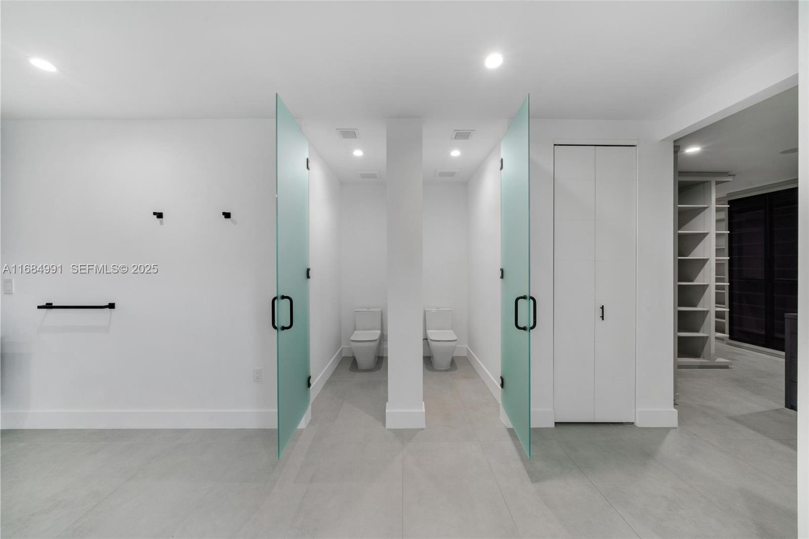 6695 Southwest 112th Street Pinecrest, FL 33156 - Photo 82 of 99 a bathroom with a shower and a toilet