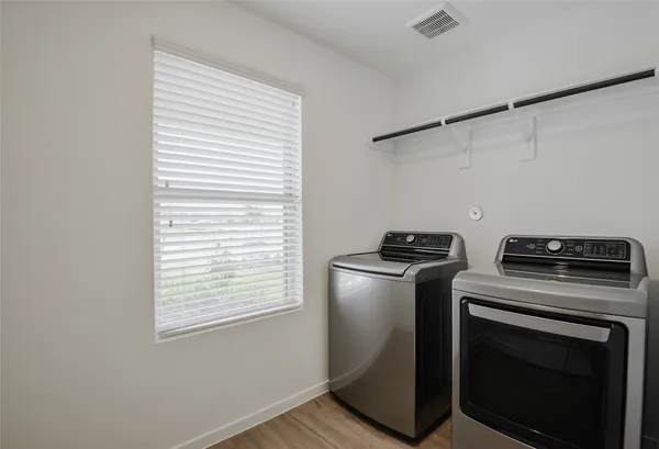 a kitchen with a stove and a microwave