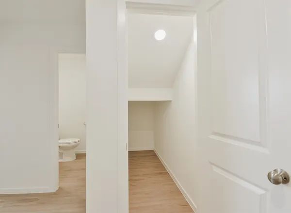 a view of a bathroom from the hallway
