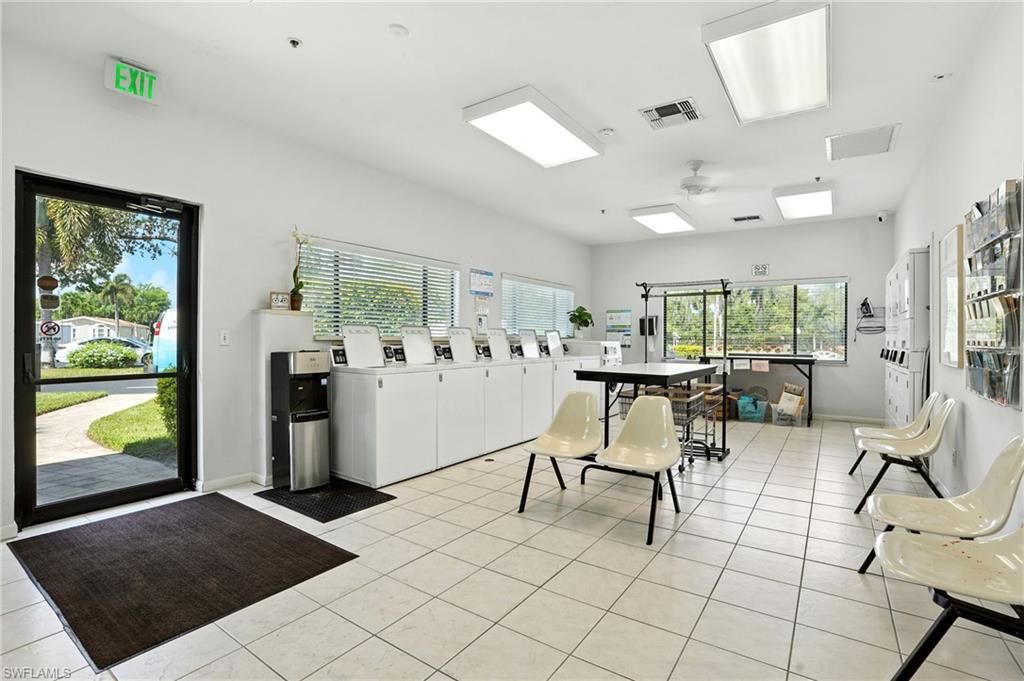 3113 Weathervane Drive Naples, FL 34120 - Photo 15 of 36 a living room with patio furniture and a window