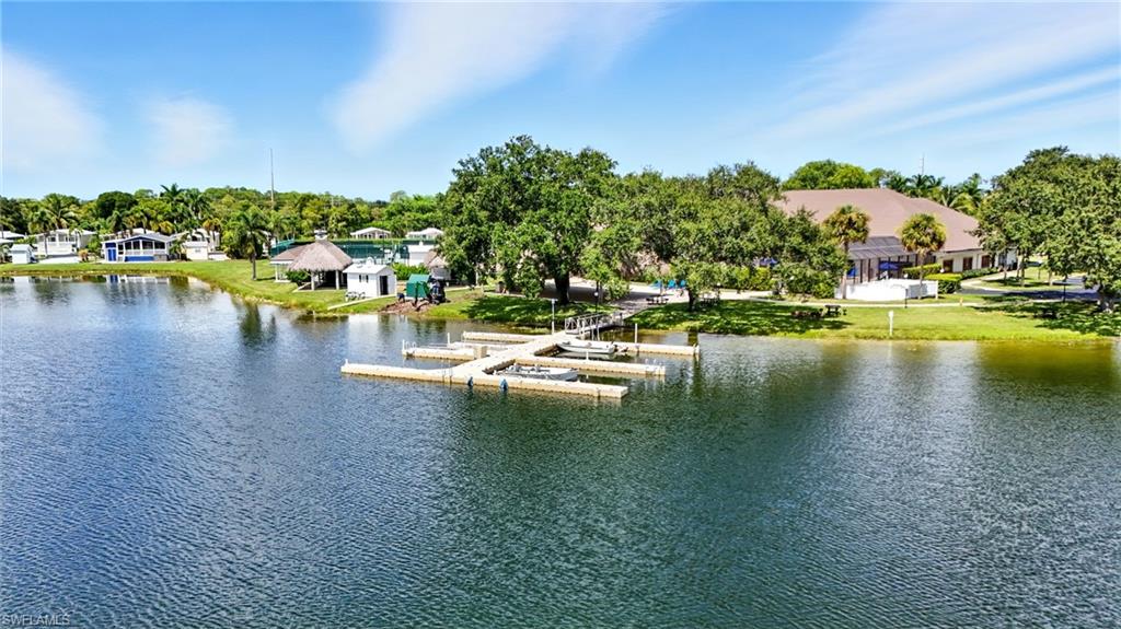 3113 Weathervane Drive Naples, FL 34120 - Photo 23 of 36 a view of a lake with houses