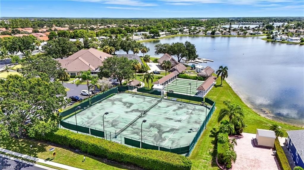 3113 Weathervane Drive Naples, FL 34120 - Photo 26 of 36 an aerial view of a residential houses with outdoor space and lake view