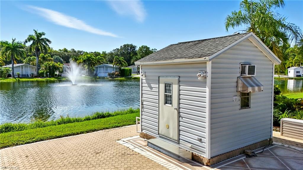 3113 Weathervane Drive Naples, FL 34120 - Photo 7 of 36 a view of a house with a yard and a garden