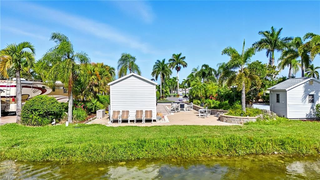 3113 Weathervane Drive Naples, FL 34120 - Photo 8 of 36 a view of a house with backyard and sitting area