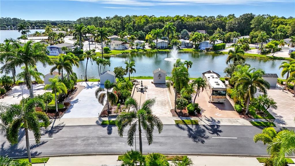3113 Weathervane Drive Naples, FL 34120 - Photo 10 of 36 an aerial view of residential houses with outdoor space and lake view
