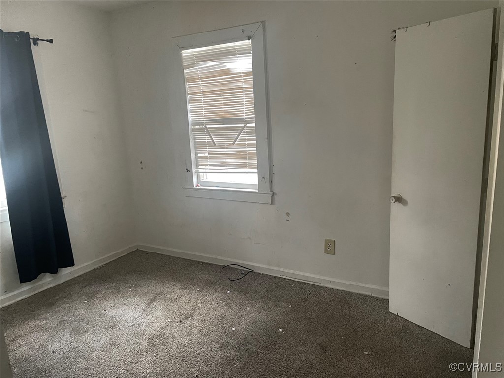 275 Low Ground Road Emporia, VA 23847 - Photo 8 of 9 Spare room with dark colored carpet