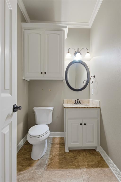 19481 Sandhill Lane Flint, TX 75762 - Photo 13 of 23 a bathroom with a toilet a sink and a mirror