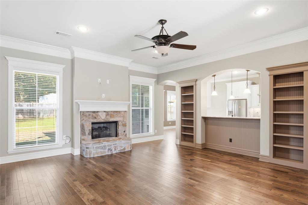 19481 Sandhill Lane Flint, TX 75762 - Photo 5 of 23 a view of a livingroom with a fireplace wooden floor and window