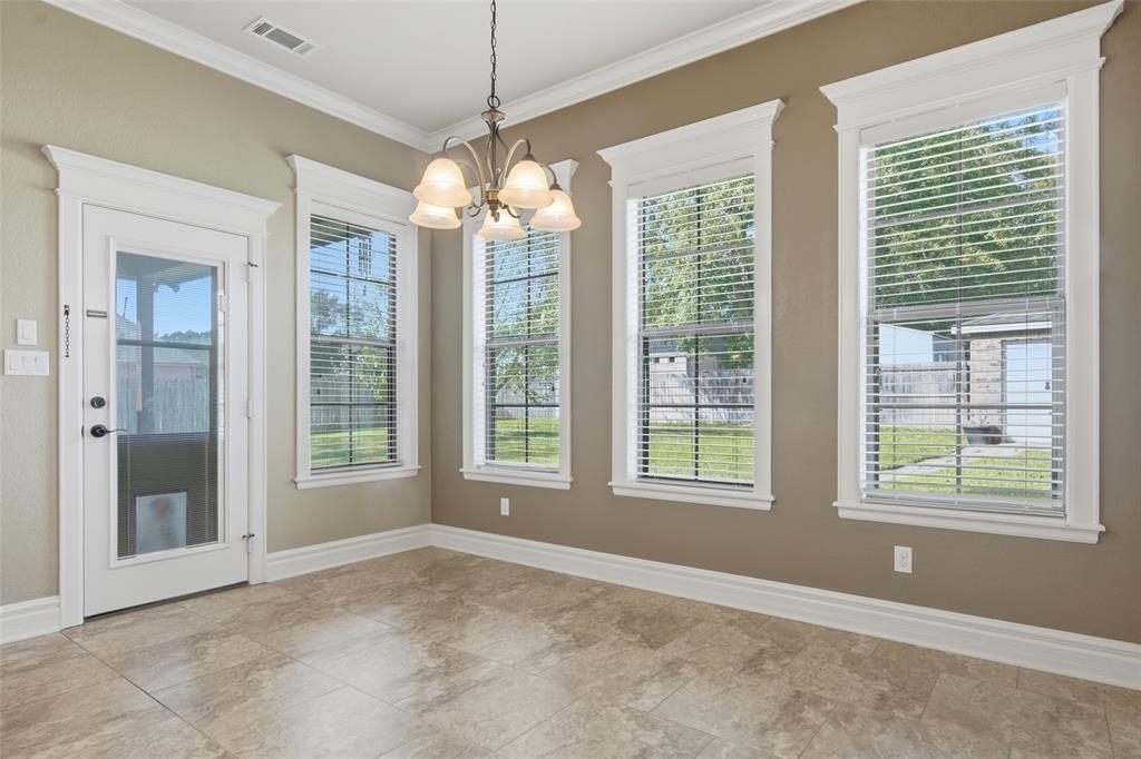 19481 Sandhill Lane Flint, TX 75762 - Photo 10 of 23 a view of an empty room with a window and chandelier