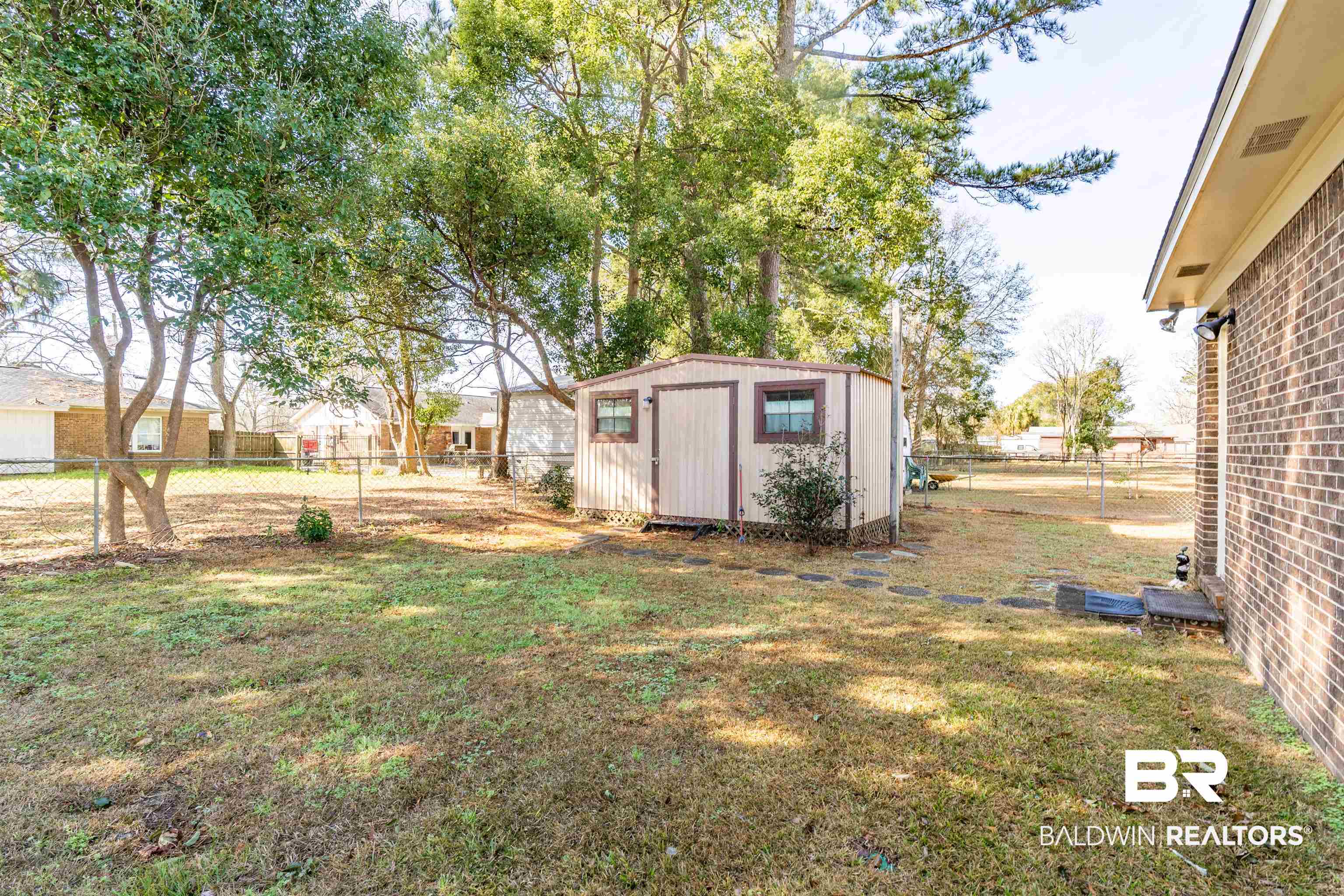 9751 Pine Knoll Road Mobile, AL 36608 - Photo 32 of 36 Fenced backyard featuring a shed