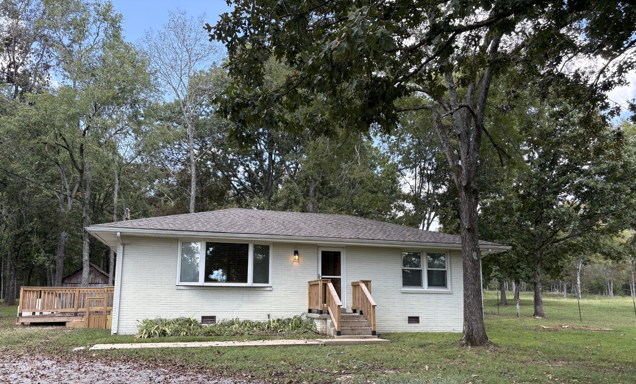 3179 Holly Grove Road Lascassas, TN 37085 - Photo 1 of 15 a front view of a house with garden