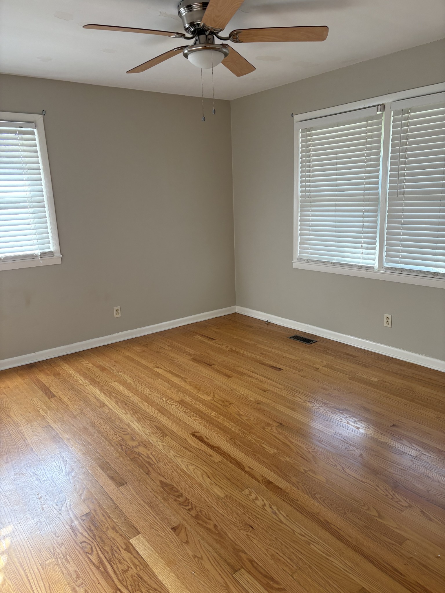 3179 Holly Grove Road Lascassas, TN 37085 - Photo 13 of 15 a view of an empty room with wooden floor and a window