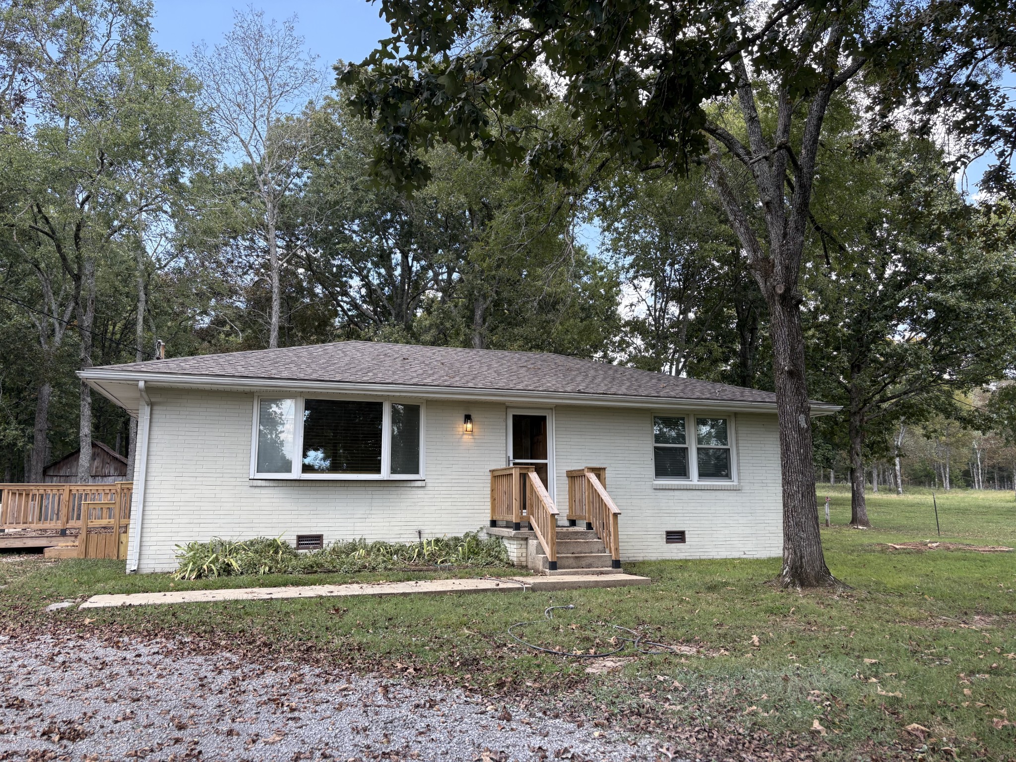 3179 Holly Grove Road Lascassas, TN 37085 - Photo 4 of 15 a front view of a house with garden