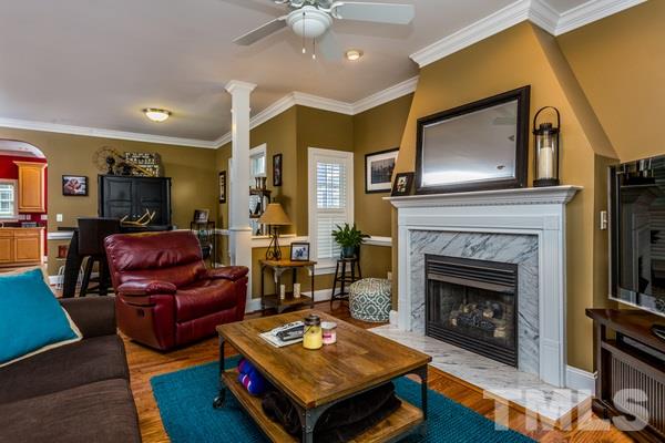 1139 Harp Street Raleigh, NC 27604 - Photo 6 of 25 a living room with furniture and a fireplace