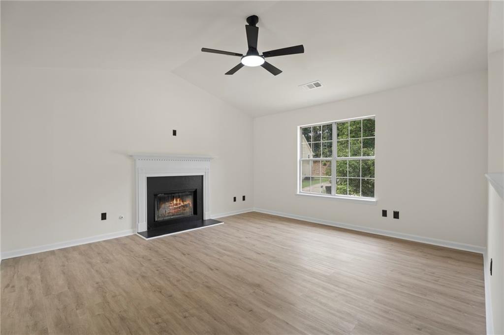 3602 Bristol Overlook Rex, GA 30273 - Photo 6 of 37 a view of an empty room with wooden floor and a window