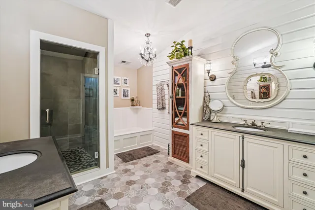 a bedroom with a bed lamp and a large window