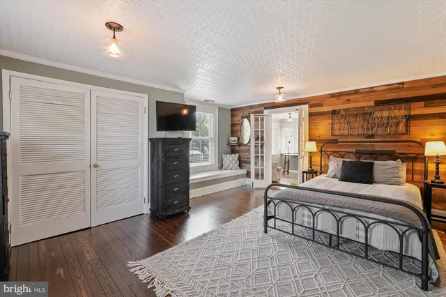 a aerial view of a house with a yard and potted plants
