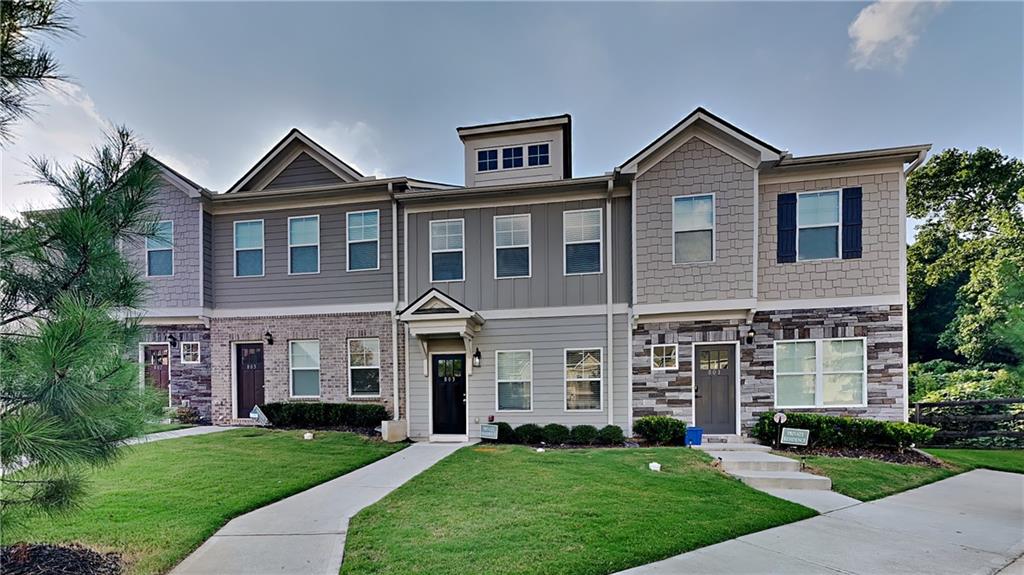 a front view of a house with a yard