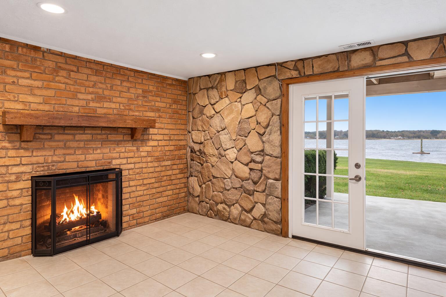 265 Indian Trail Munith, MI 49259 - Photo 13 of 20 Basement Fire Place Walkout